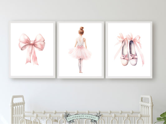 Set of 3 Ballet Nursery Prints, featuring a ballerina, bow, and ballet slippers. Perfect for your ballet nursery decor or dance inspired bedroom, these charming prints inspire imagination and foster a love for ballet, adding an elegant touch to your baby girls room and dreams of graceful twirls.