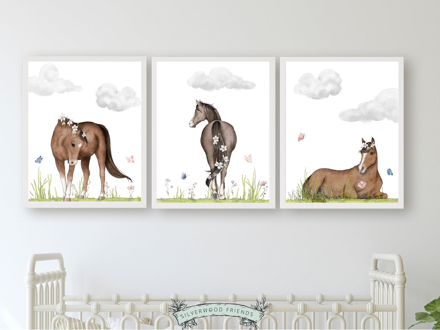 Set of 3 Horse Nursery Prints, showcasing serene watercolour scenes of horses in paddocks with beautiful wildflowers and butterflies. Ideal for your baby girls horse nursery decor or as a unique horse lovers baby shower gift or birthday gift.