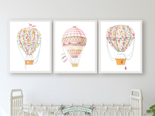 Set of 3 Pink Hot Air Balloon Prints. Whether adorning a nursery or adding a pop of colour to a dorm room, these vibrant prints are as playful as they are versatile, making them an ideal choice for both personal decor and thoughtful gifts for any occasion.