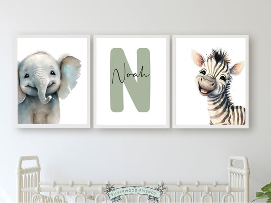 Safari Nursery Name Prints featuring adorable laughing elephant and zebra with custom name and letter. Perfect for your safari nursery decor and also makes a unique gender neutral baby shower gift.