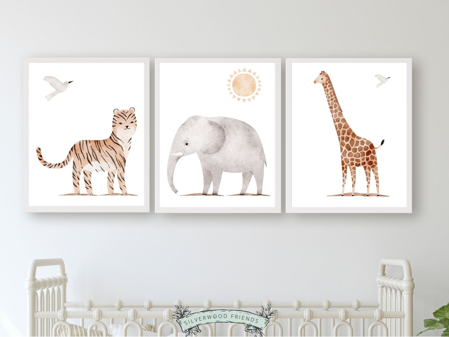 Safari Animal Nursery Prints Set of 3 featuring watercolour tiger, elephant and giraffe. These delightful prints are perfect for your safari nursery decor and also make a lovely gender neutral safari baby shower gift.