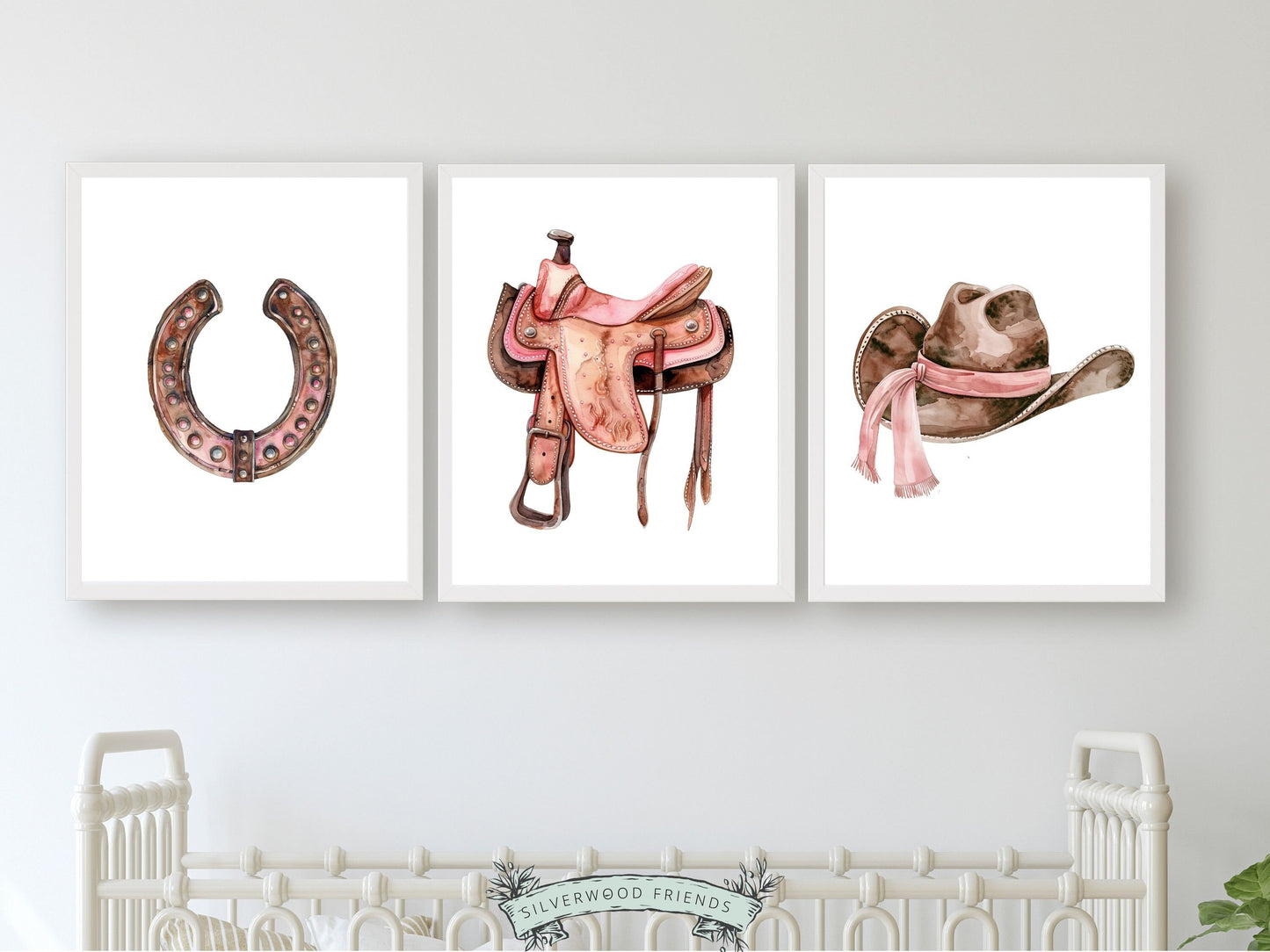 Infuse your baby girls nursery with western flair using our Set of 3 Cowgirl Nursery Prints, showcasing watercolour cowgirl essentials in soft pink and brown hues.