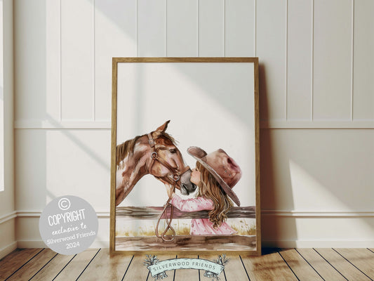 Watercolor print depicting a cowgirl kissing her beloved horse atop a paddock fence. This charming print effortlessly enhances your cowgirl themed decor, perfect for your little ones space or as a baby shower gift for horse riding enthusiasts.