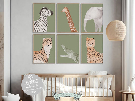 Safari Animal Nursery Prints Set of 6 featuring adorable watercolor safari animals on a green background. These delightful prints are perfect for your safari nursery decor and also make a lovely gender neutral safari baby shower gift.