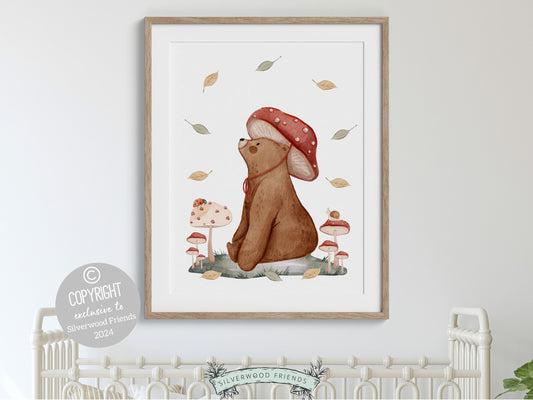 Enchanting Woodland Bear Nursery Print, featuring adorable woodland bear amidst delightful mushrooms and falling leaves, perfect for creating a whimsical atmosphere in your woodland nursery decor or as a heartwarming gender neutral baby shower gift.