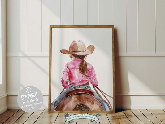 Enchanting watercolor print depicting a little girl riding her horse. This charming artwork effortlessly enhances your cowgirl themed decor, perfect for your little ones space or as a heartfelt baby shower gift for horse riding enthusiasts.