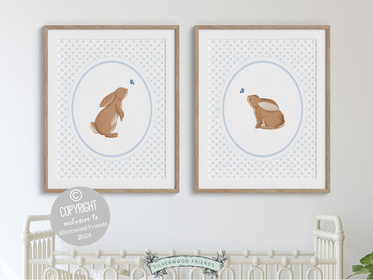 Our gorgeous Bunny Nursery Print Set of 2, showcasing adorable bunny rabbits and blue butterflies with baby blue wallpaper pattern, is perfect for your woodland nursery decor and makes a unique baby shower gift for both boys and girls.