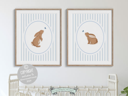 Our gorgeous Bunny Nursery Print Set of 2, showcasing adorable bunny rabbits and blue butterflies with baby blue chinoiserie wallpaper pattern, is perfect for your woodland nursery decor and makes a unique baby shower gift for both boys and girls.