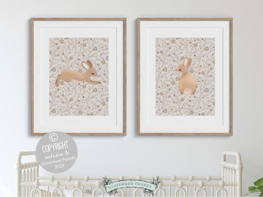 Our gorgeous Bunny Nursery Print Set of 2, showcasing adorable bunny rabbits on a neutral floral pattern is perfect for your woodland nursery or wildflower nursery decor and makes a unique gender neutral baby shower gift for both boys and girls.