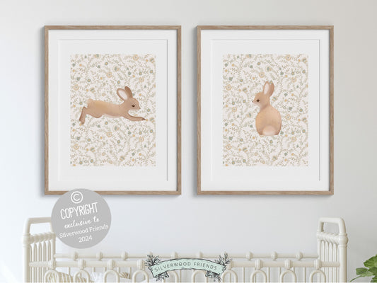 Our gorgeous Bunny Nursery Print Set of 2, showcasing adorable bunny rabbits on a neutral floral pattern is perfect for your woodland nursery or wildflower nursery decor and makes a unique gender neutral baby shower gift for both boys and girls.