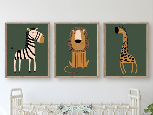 Our green Boho Safari Nursery Prints with jungle animals zebra, lion and giraffe is set on a green background and perfect for your jungle nursery decor or as safari baby shower gift.