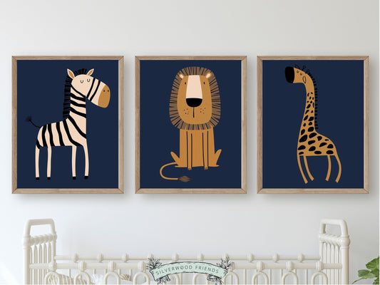 These Navy Blue Jungle Nursery Prints with jungle animals zebra, lion and giraffe is set on a navy blue background and perfect for your jungle nursery decor or as a thoughtful safari baby shower gift.