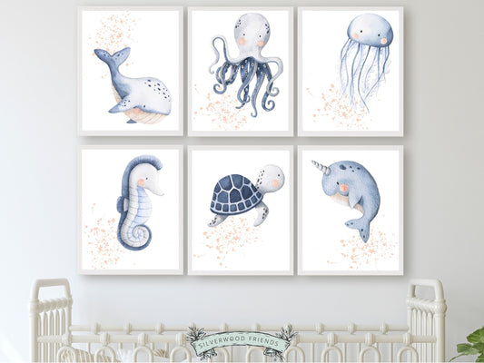 Our Set of 6 Baby Girl Sea Life Nursery Prints with pink watercolour splashes, will spark their imagination and is the perfect addition to your ocean themed nursery or sea themed nursery decor.