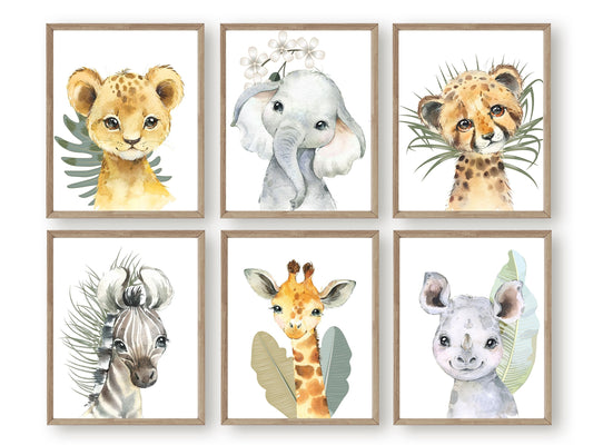 This Baby Safari Animal Print Set of 6 with baby safari animals lion, elephant, leopard, zebra, giraffe and rhino is set on a white background with tropical jungle leaves and is perfect for your jungle nursery decor or as a safari baby shower gift.