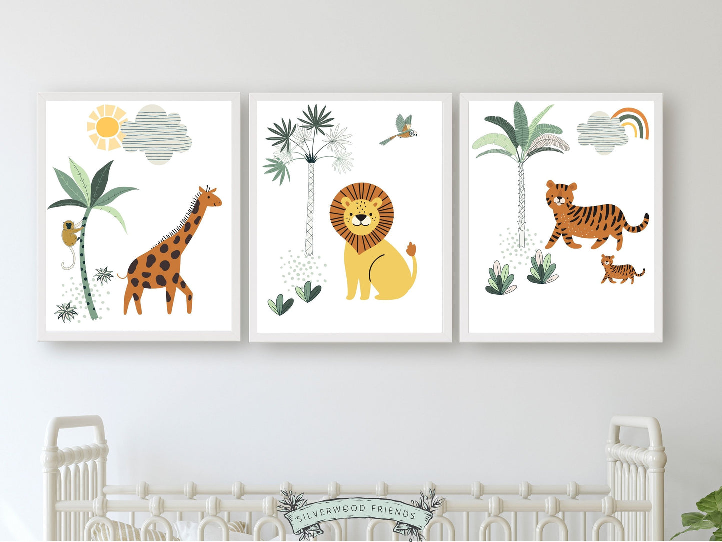 This Safari Nursery Print Set of 3 with our jungle animals giraffe, lion and tiger is set on a white background with tropical jungle plants and is perfect for your jungle theme nursery or safari nursery decor.