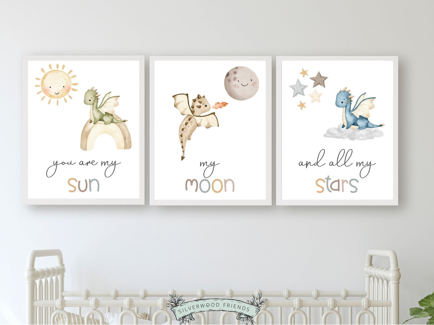 Transform your baby's nursery into a harmonious and dreamy sanctuary with this You Are My Sun Dragon Nursery Prints featuring baby dragons, a sun, moon, stars, and the loving quote "You are my sun, my moon, and all my stars." Perfect for your dragon nursery decor and as a baby shower gift.