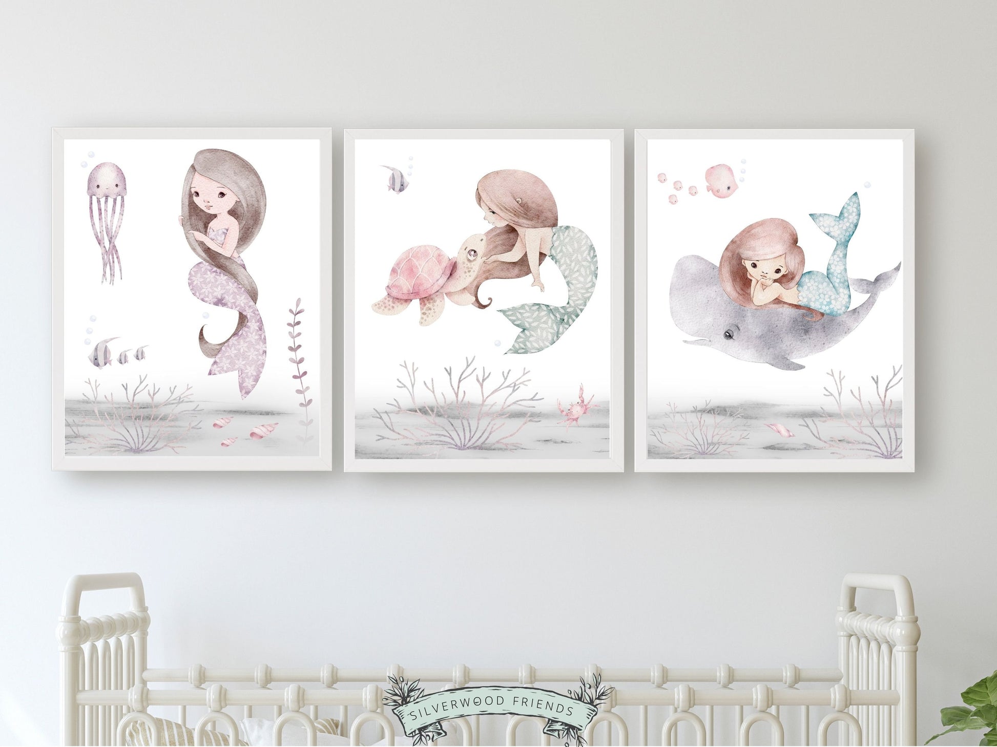 Dive into a world of underwater enchantment with our Set of 3 Mermaid Nursery Prints. These beautiful watercolour illustrations showcase mermaids swimming alongside a delightful array of sea creatures including a sea turtle, whale, jelly fish, fish, and coral, adding a touch of magic to your baby girl's nursery decor.