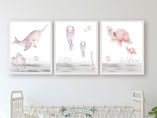 Set of 3 pastel sea life nursery prints, featuring captivating watercolour illustrations of sea creatures such as a sea turtle, narwhal and jelly fish, adding a touch of magic to your baby girl&#39;s nursery decor.