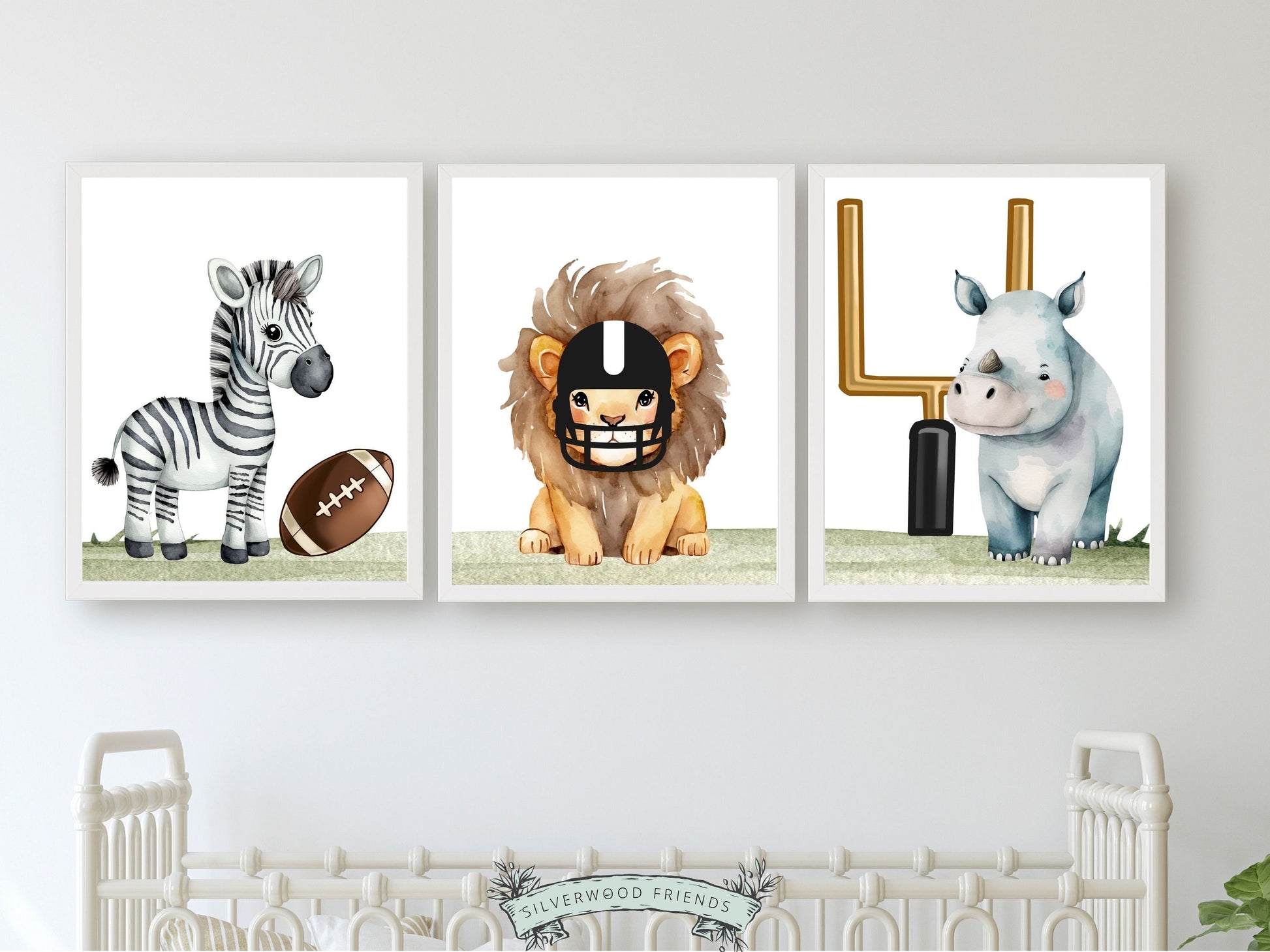 Elevate your sports nursery decor or football themed nursery room with this adorable Set of 3 Football Animal Nursery Prints, featuring watercolour safari animals zebra, lion and rhino with a football, football helmet, and football goal posts.