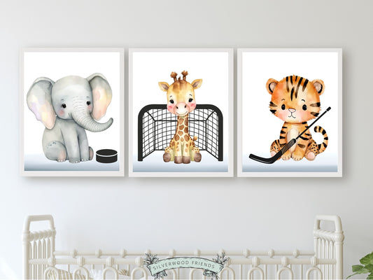 Elevate your sports nursery decor or hockey themed nursery room with this adorable Ice Hockey Nursery Print Set of 3, featuring watercolour safari animals elephant, giraffe and tiger with hockey puck, goal and stick.