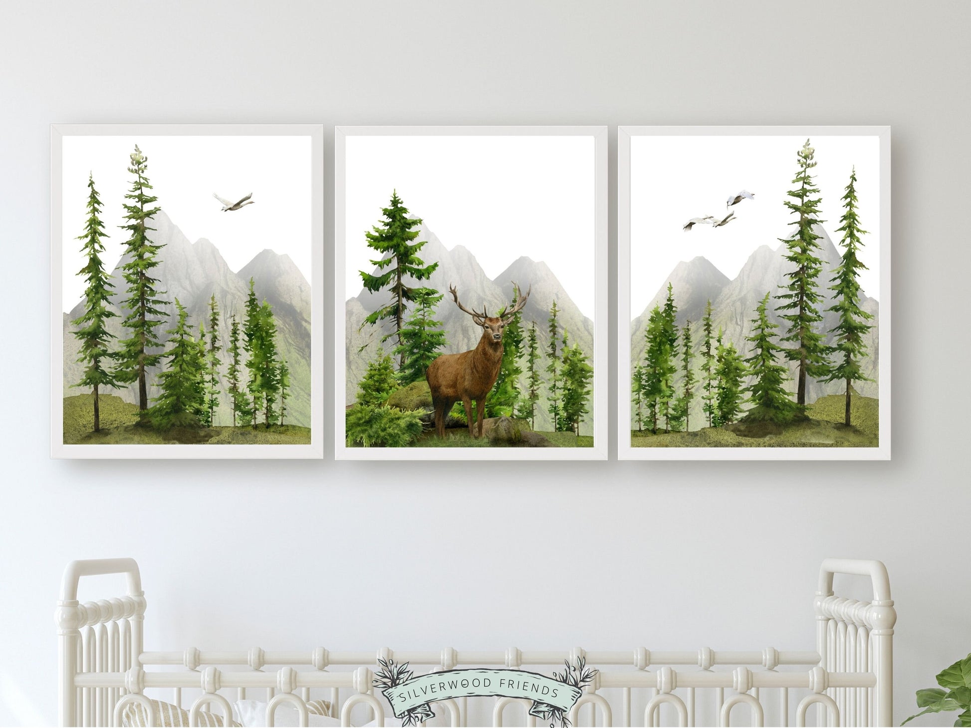 Transform your space into a serene mountain retreat with this enchanting set of 3 watercolour mountain and forest landscape prints with brown watercolour deer. Ideal for adding a touch of natural beauty to your mountain nursery