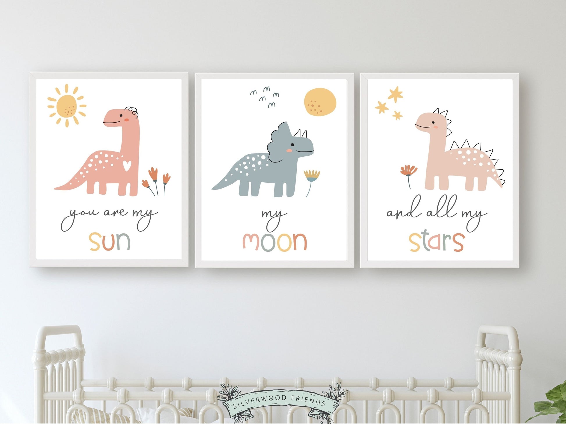 This Set of 3 Dinosaur Nursery Prints, featuring a sun, moon, stars with blue and pink dinosaurs, along with the loving and positive quote "You are my sun, my moon, and all my stars" will create a harmonious and dreamy atmosphere in your baby girls nursery and also makes the perfect dinosaur baby shower gift.