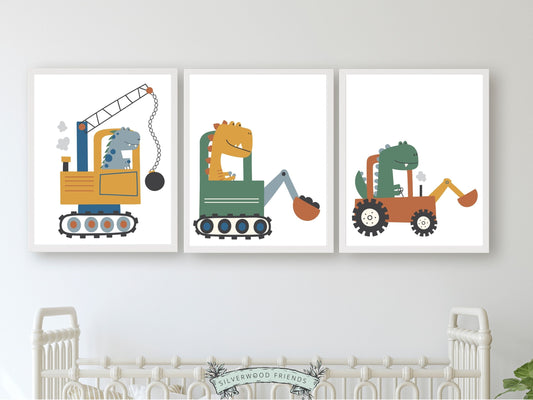 Our delightful Set of 3 Dinosaurs Driving Trucks Nursery Prints features dinosaurs on wheels - the perfect addition to any dinosaur lovers baby boy's nursery room! Each print showcases a different prehistoric creature driving a different type of digger truck and is perfect for your dinosaur theme nursery or transport theme nursery.