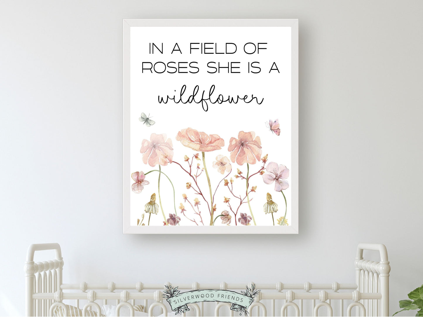 Our gorgeous wildflower nursery print with watercolor wildflower meadow flowers and quote In a field of roses she is a wildflower, is perfect for your wildflower nursery decor and part of our best selling wildflower collection.