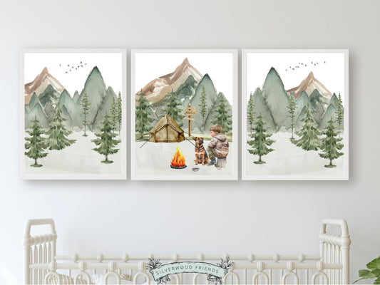 Add a touch of natural wonder to your babys nursery with our endearing Boy and His Dog Camping Nursery Prints. These watercolour prints showcase a serene forest and mountain landscape, where a little boy and his dog sit by a campfire.