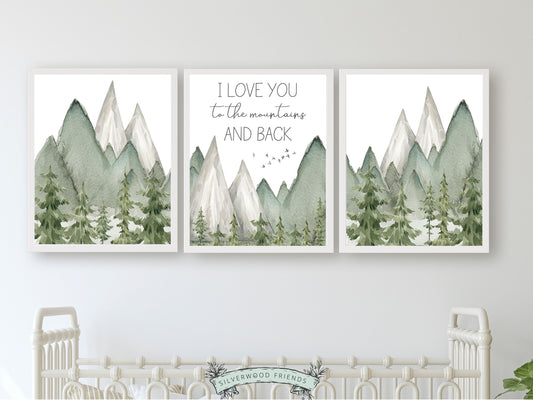 Transform your space into a serene mountain retreat with this enchanting Set of 3 watercolour mountain prints, featuring the quote I love you to the mountains and back set against a mountain and woodland forest landscape.