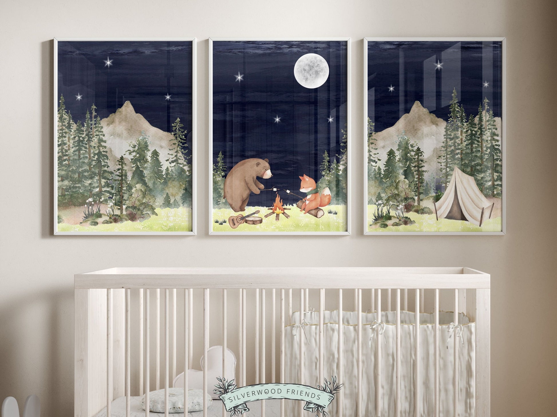 Our adorable baby bear and fox camping nursery prints featuring watercolor woodland forest and mountain landscape with a bear and fox by a campfire at night, are the perfect addition to your babys woodland nursery decor.