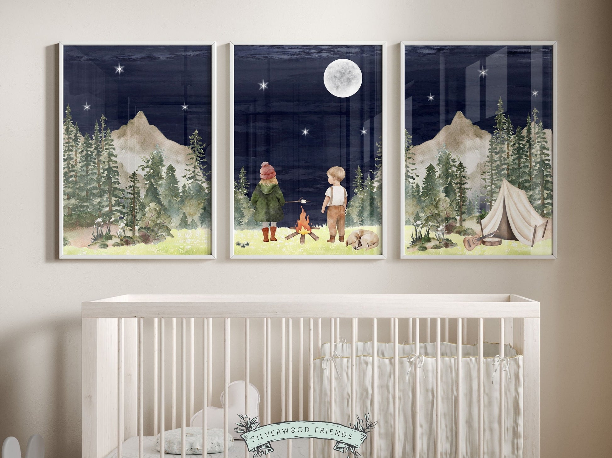 Our adorable Kids Camping Nursery Prints featuring watercolor woodland forest and mountain landscape with a boy, a girl and their dog by a campfire at night, are the perfect addition to your babys woodland nursery decor.