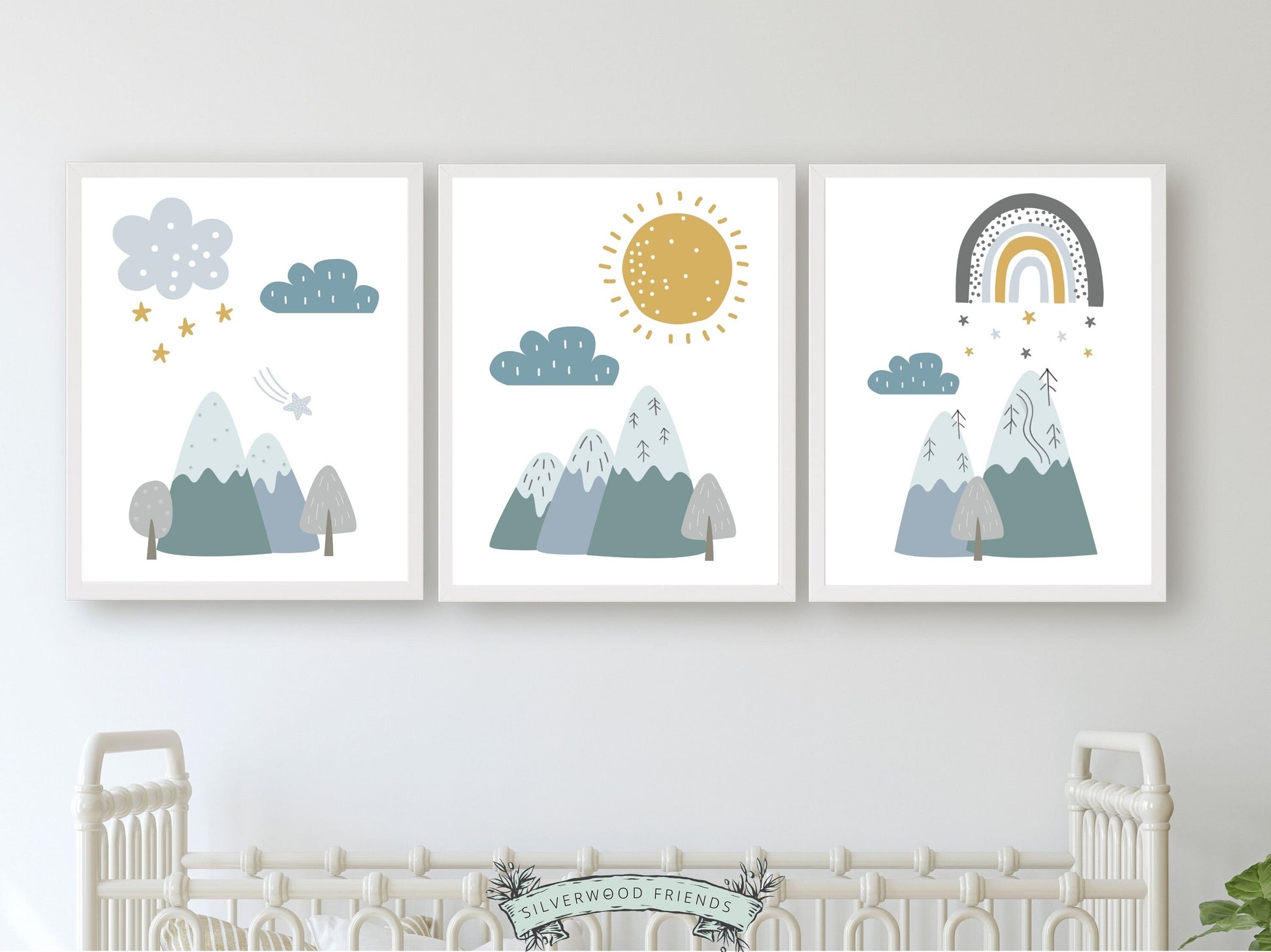 Our Boho Mountain Nursery Print Set of 3, features Nordic mountains, a sun, clouds, stars and rainbow in a calming blue and green color palette, and will create a harmonious and dreamy atmosphere in your little one's nursery. 