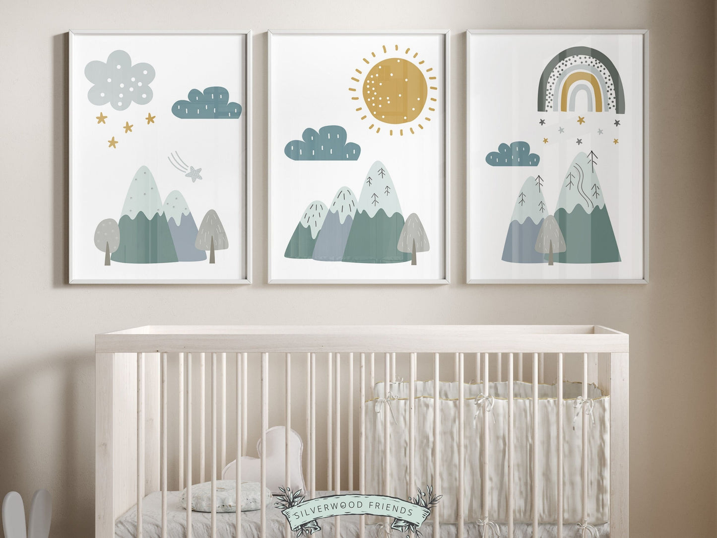 Set of 3 Boho Mountain Nursery Prints, features nordic mountains, a sun, clouds, stars and rainbow in a calming blue and green color palette, and will create a harmonious and dreamy atmosphere in your little one&#39;s nursery.