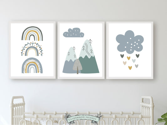 Our Set of 3 Blue Boho Mountain Nursery Prints, featuring Nordic mountains, rainbows and love hearts in tranquil blue and green tones will create a dreamy atmosphere in your little one's nursery.