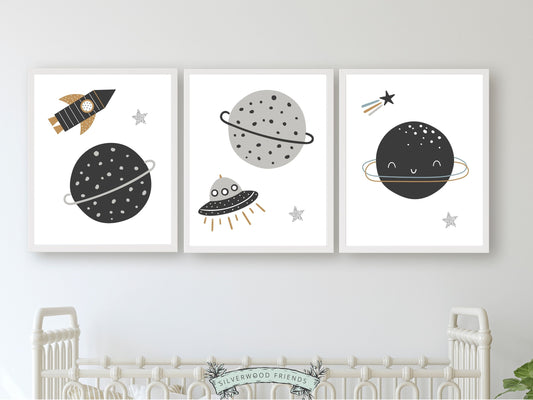 Transform your baby boy's nursery decor into a realm of cosmic wonder with our enchanting Set of 3 Space Nursery Prints featuring planets, rockets, moon, stars, and spaceships in monochrome colors, igniting creativity and fostering boundless imagination in your little one.