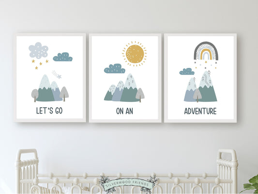 Our Set of 3 Mountain Adventure Nursery Prints, featuring Nordic mountains, a sun, clouds, stars, rainbow, and the quote "Let's go on an adventure" in tranquil blue and green tones will create a dreamy atmosphere in your little one's nursery. Perfect for your little exploring and also makes a unique baby shower gift.