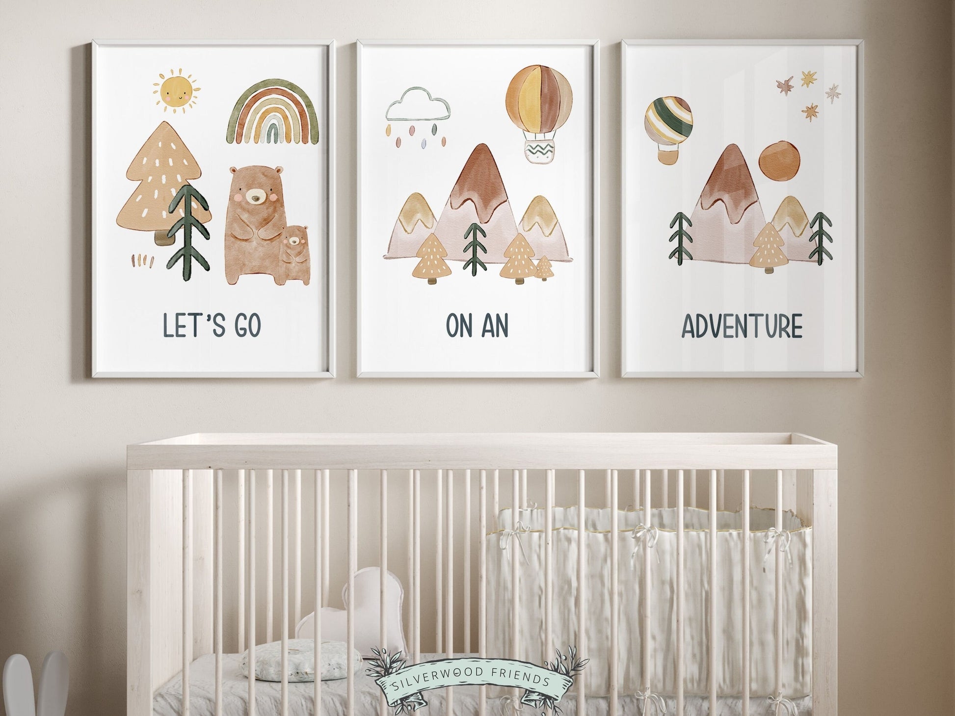 Set of 3 Adventure Nursery Prints, featuring watercolor boho mountains, a serene forest, and two adorable bears embarking on a journey. These prints bring a touch of magic with the uplifting message, Lets go on an adventure.