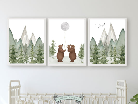 Set of 3 Bear Family Nursery Prints, featuring a family of bears holding the moon and set against a mountain and woodland forest landscape. Ideal for adding a touch of natural beauty to your woodland nursery and makes a unique gender neutral baby shower gift